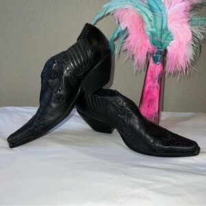 BCBG booties. Black leather with buck stitches and floral detail. Size 8.5B.